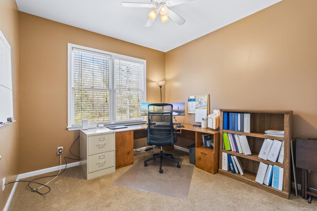466 Middleton Place Grayson, GA 30017 - Photo 30 of 106 a view of a workspace with furniture and a window