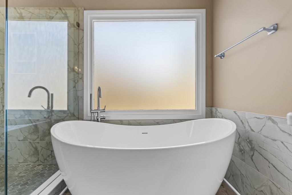466 Middleton Place Grayson, GA 30017 - Photo 38 of 106 a white bath tub sitting next to a window