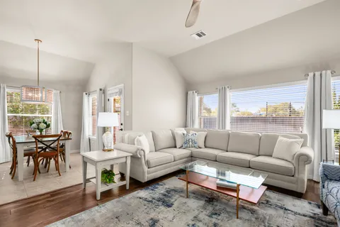 a living room with furniture and a large window
