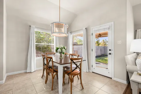 a view of a dining room with furniture window and outside view