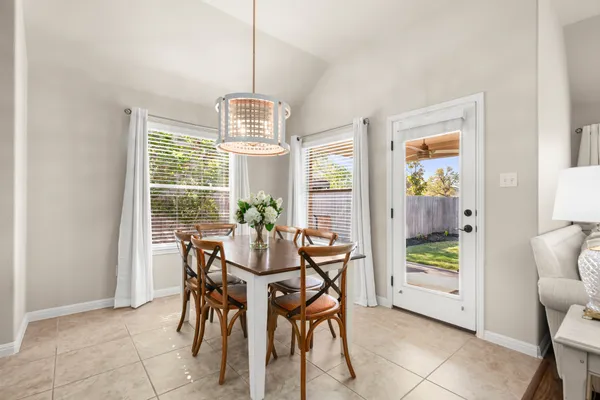 a view of a dining room with furniture window and outside view