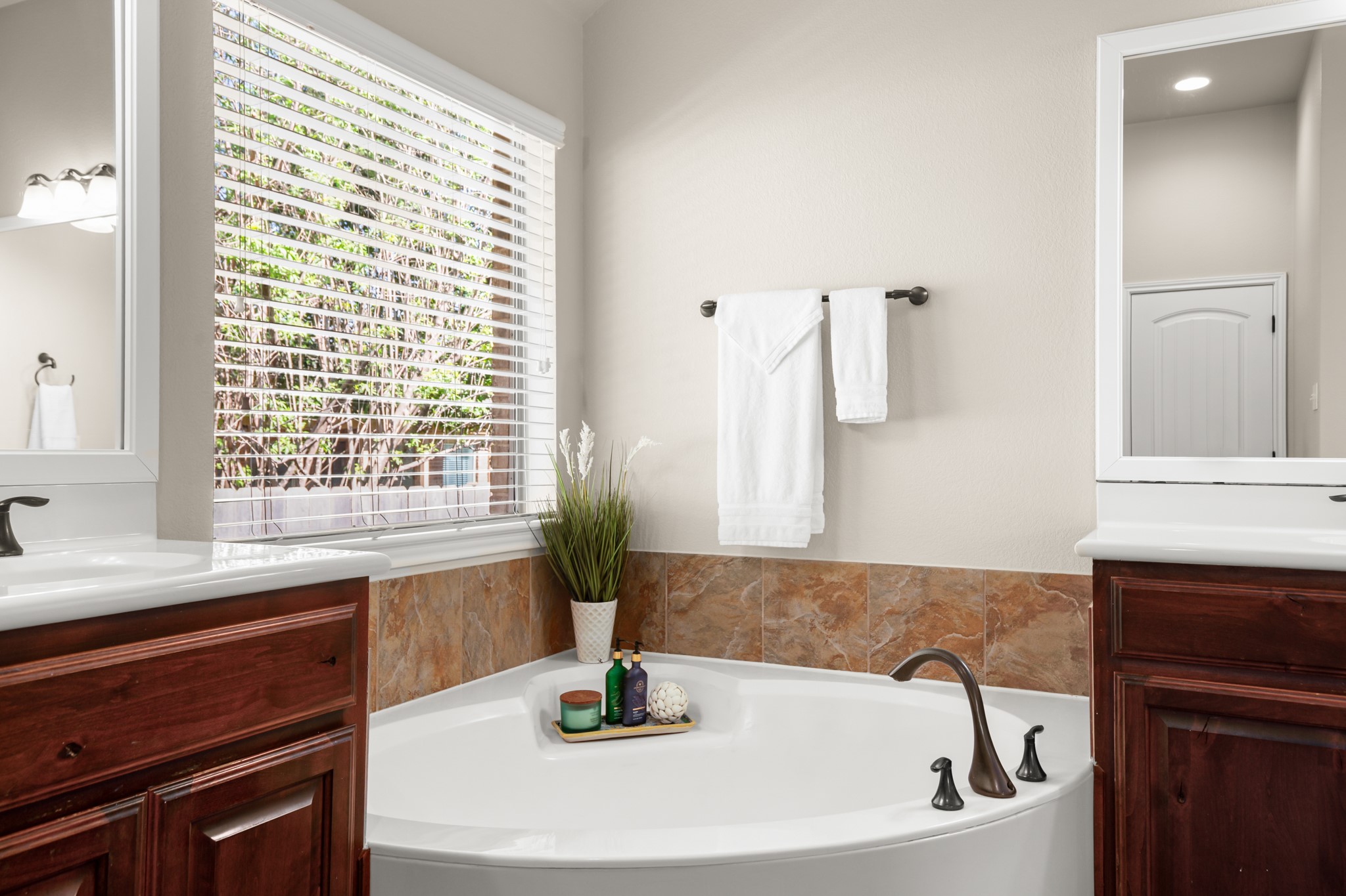 1906 Tall Chief Leander, TX 78641 - Photo 21 of 38 a bathroom with a bathtub and a sink