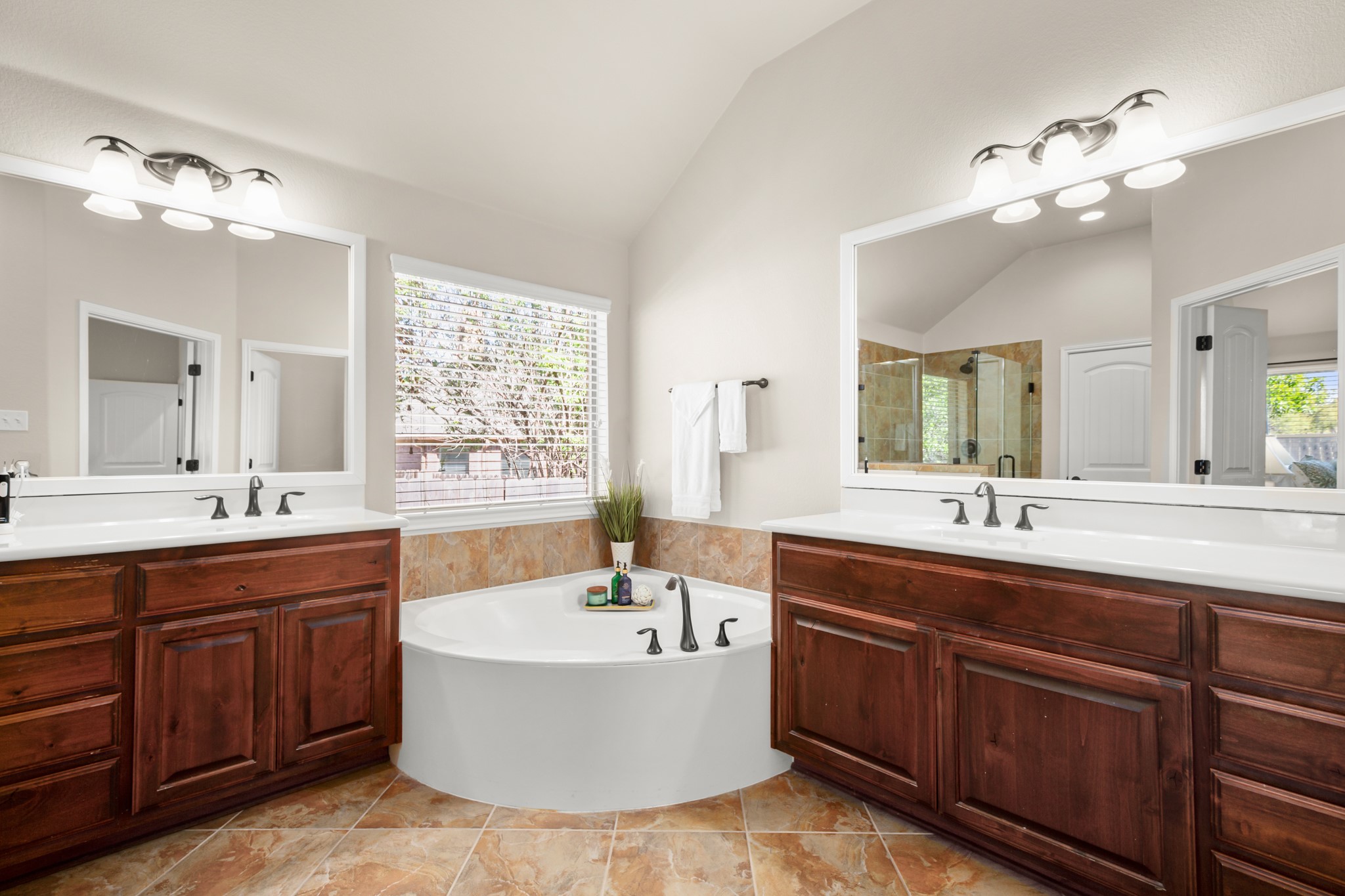 1906 Tall Chief Leander, TX 78641 - Photo 22 of 38 a spacious bathroom with a tub double sink and mirror