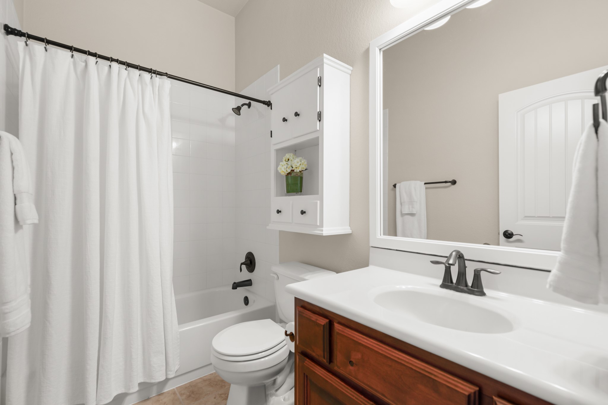 1906 Tall Chief Leander, TX 78641 - Photo 25 of 38 a bathroom with a sink a toilet and a mirror