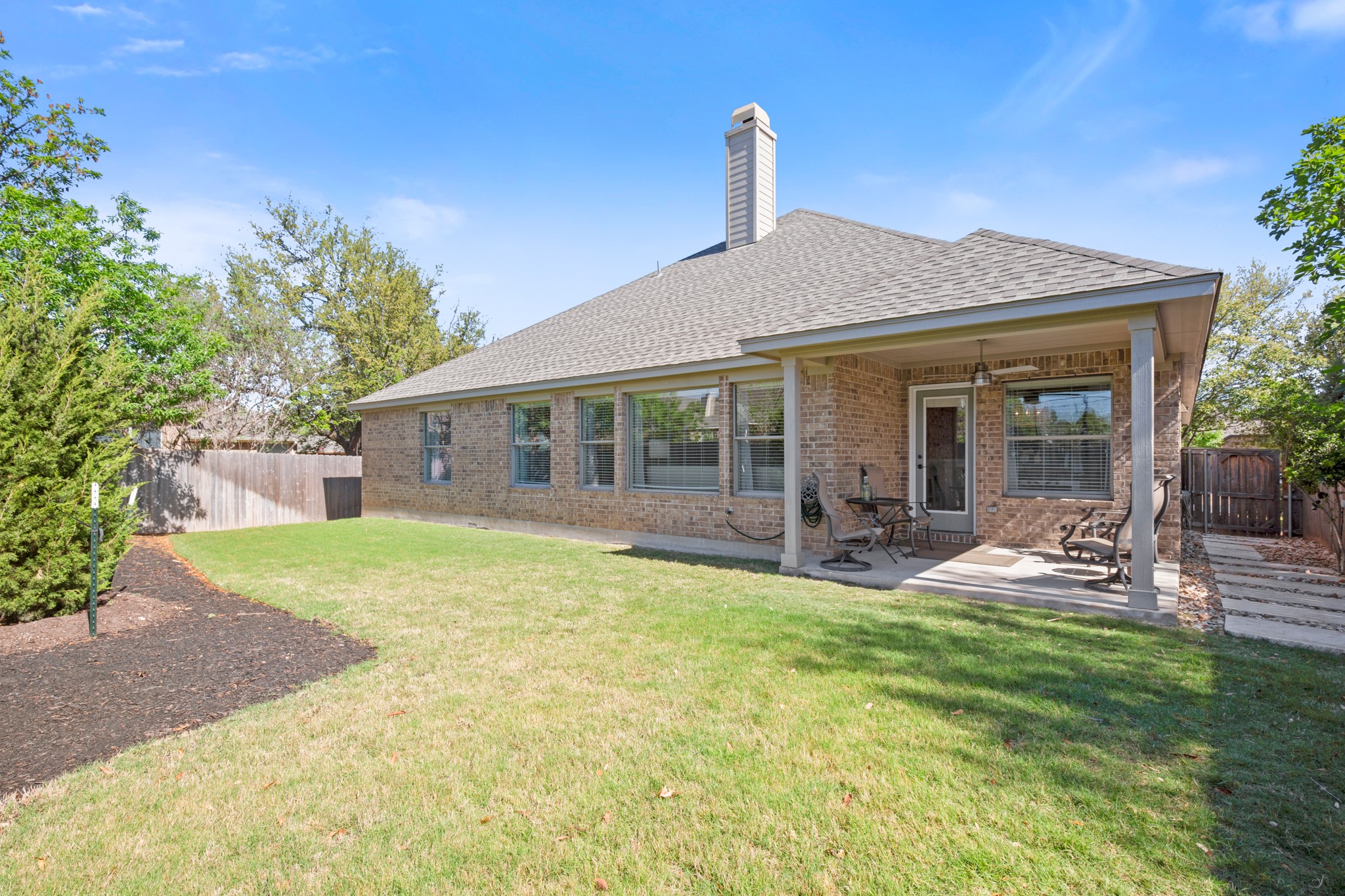 1906 Tall Chief Leander, TX 78641 - Photo 29 of 38 a house view with a garden space