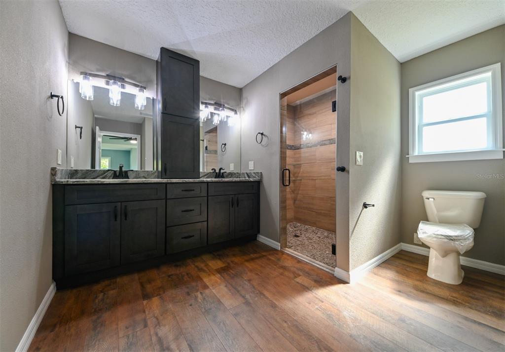 5430 West Tortuga Loop Lecanto, FL 34461 - Photo 14 of 51 a bathroom with a sink and a mirror