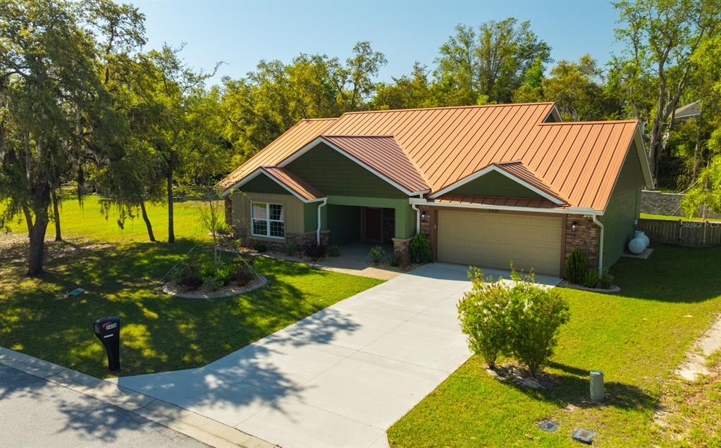 5430 West Tortuga Loop Lecanto, FL 34461 - Photo 45 of 51 a front view of a house with a yard