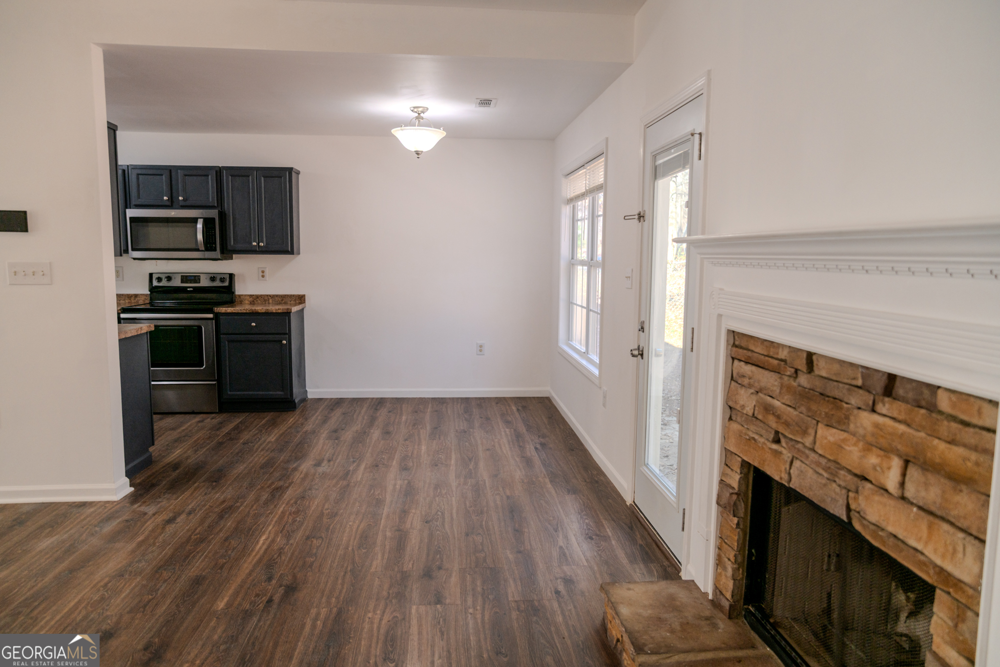 55 Corn Row Court Newnan, GA 30263 - Photo 13 of 72 a kitchen with a stove and a refrigerator