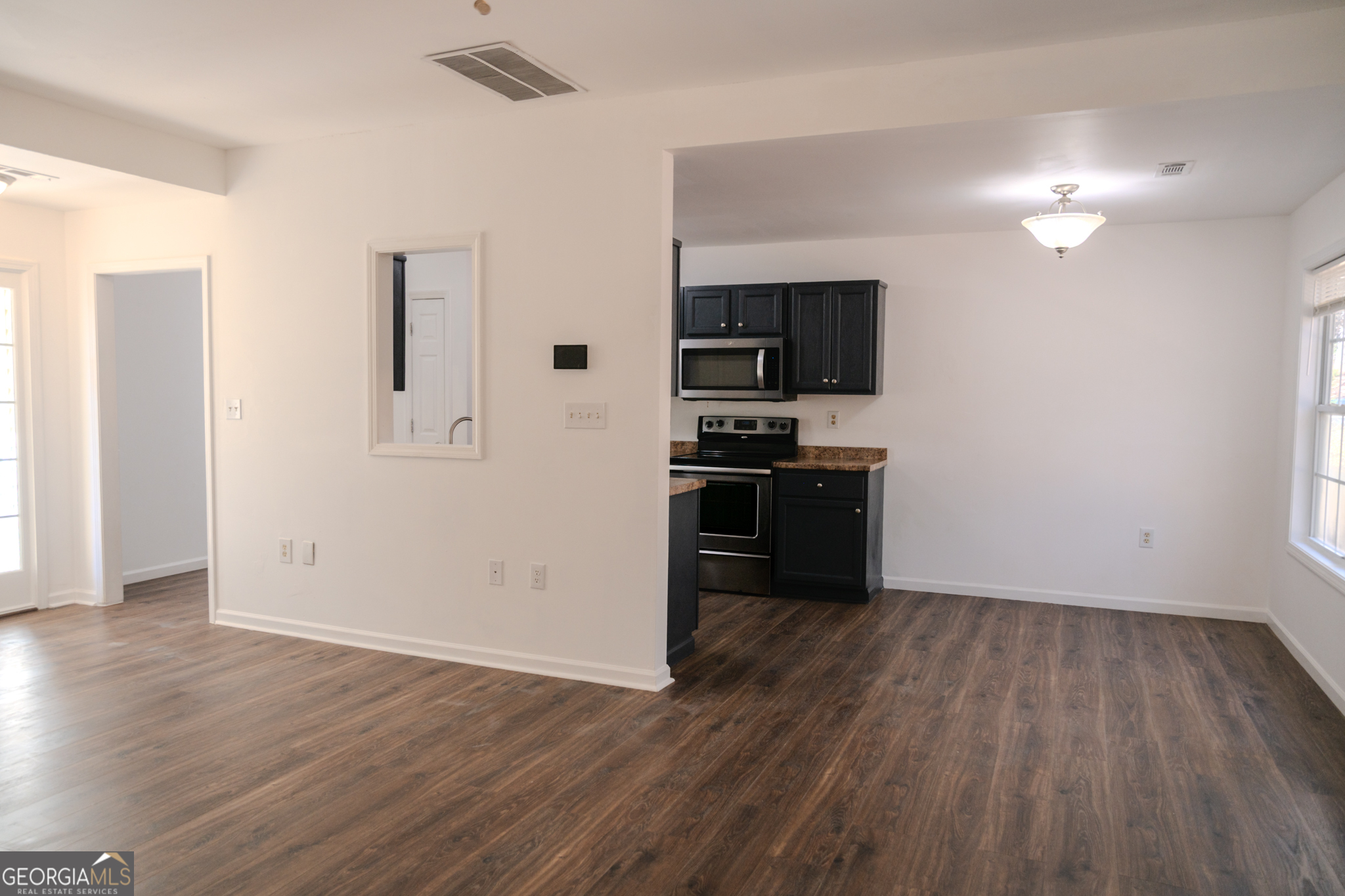 55 Corn Row Court Newnan, GA 30263 - Photo 14 of 72 a view of kitchen with wooden floor electronic appliances and window