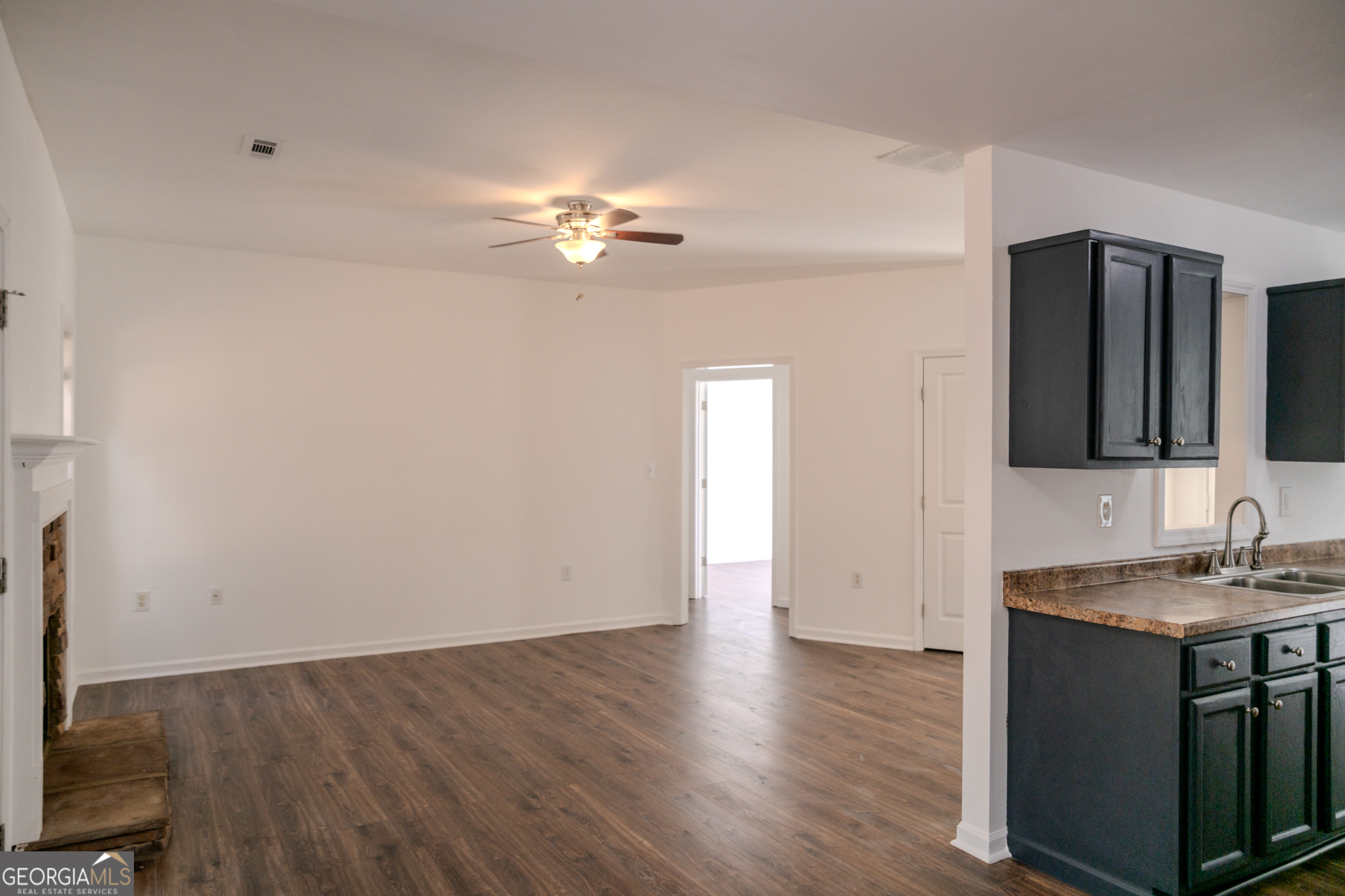 55 Corn Row Court Newnan, GA 30263 - Photo 17 of 72 wooden floor in an empty room with a window