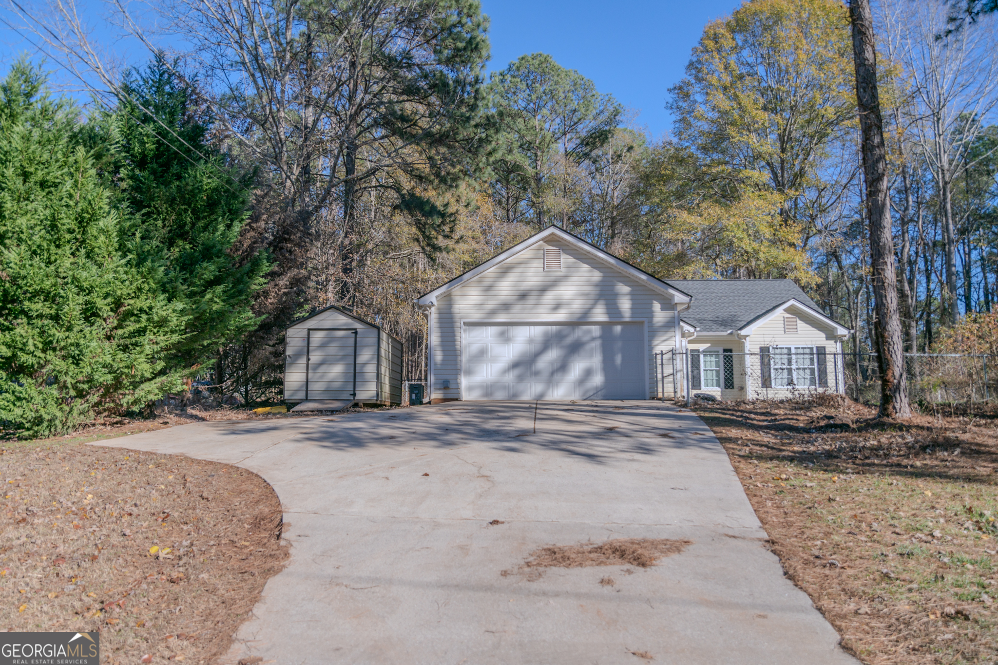 55 Corn Row Court Newnan, GA 30263 - Photo 2 of 72 a front view of a house with a yard covered with trees