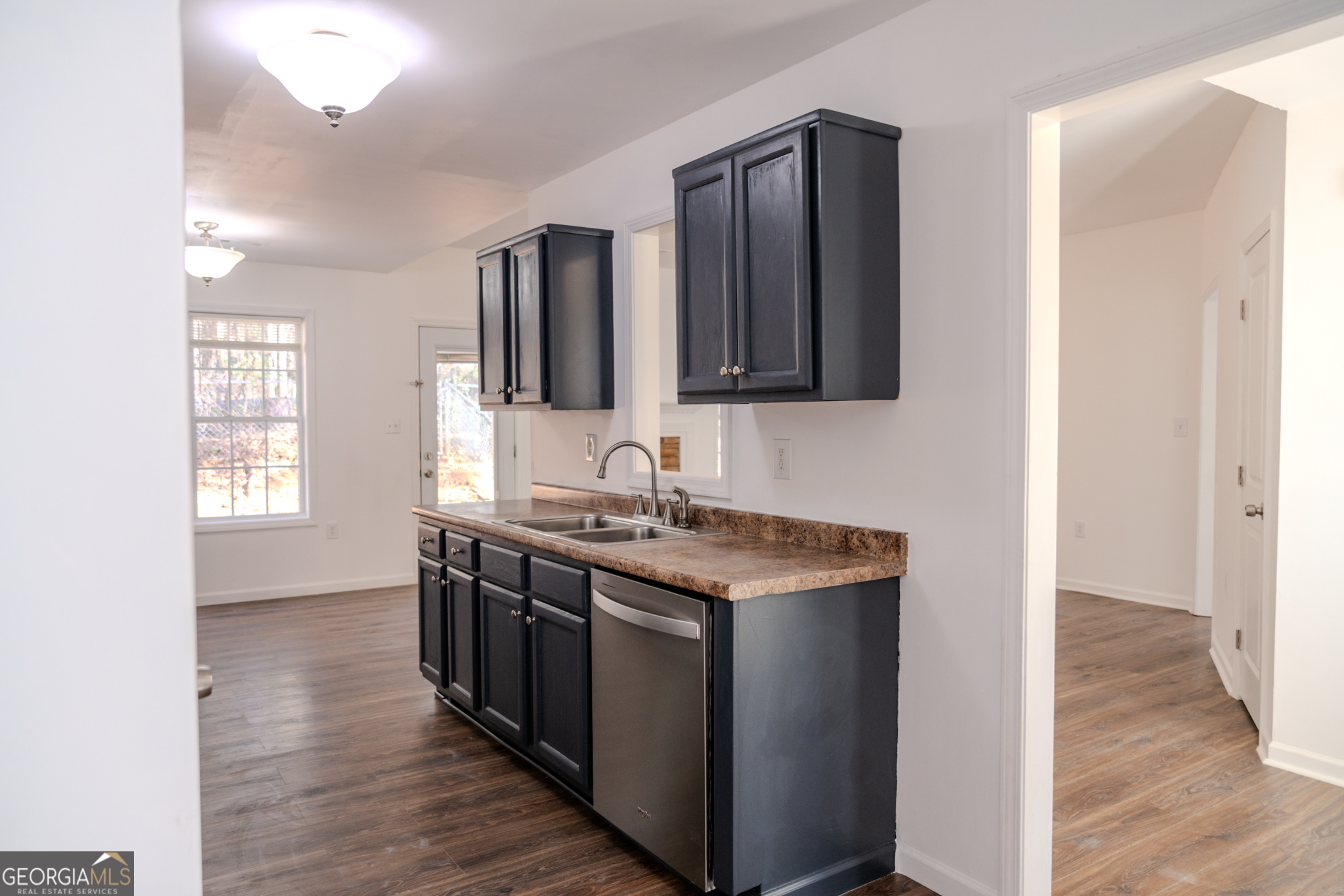55 Corn Row Court Newnan, GA 30263 - Photo 24 of 72 a kitchen with stainless steel appliances granite countertop a stove and a sink