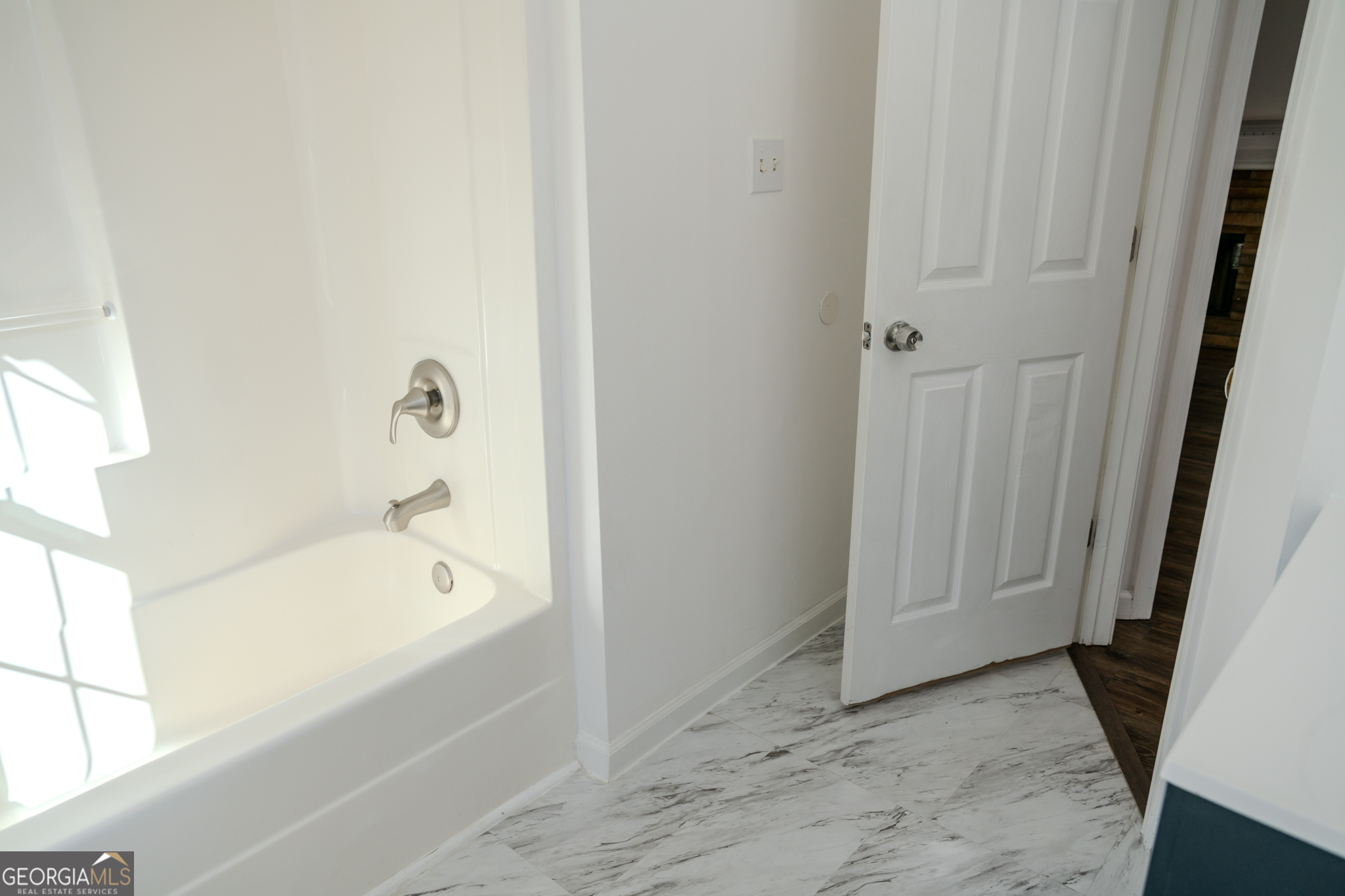 55 Corn Row Court Newnan, GA 30263 - Photo 41 of 72 a bathroom with a tub and shower