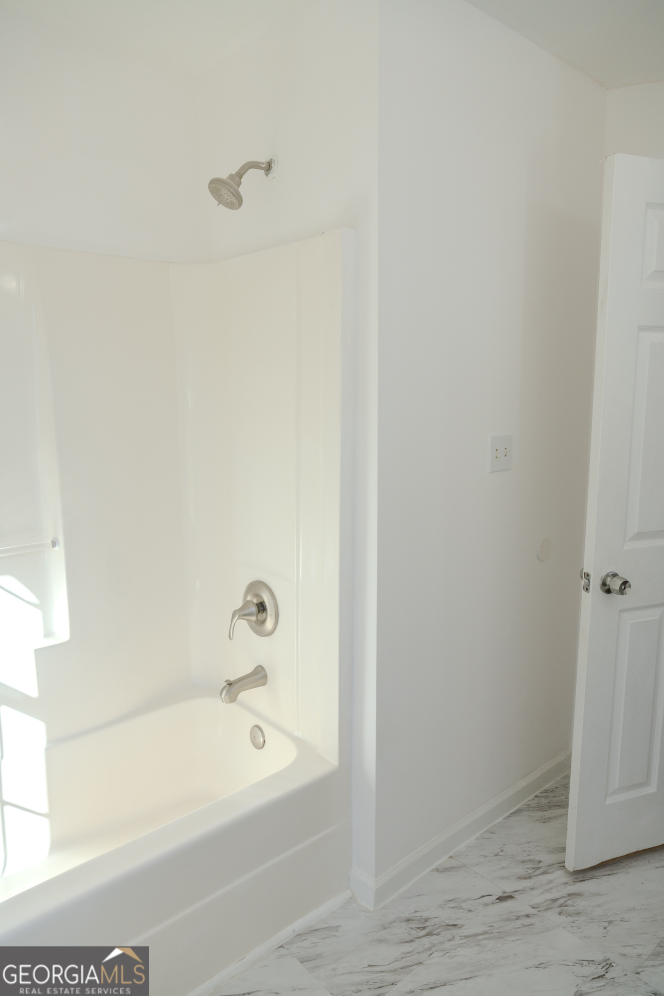55 Corn Row Court Newnan, GA 30263 - Photo 42 of 72 a bathroom with a tub and a window