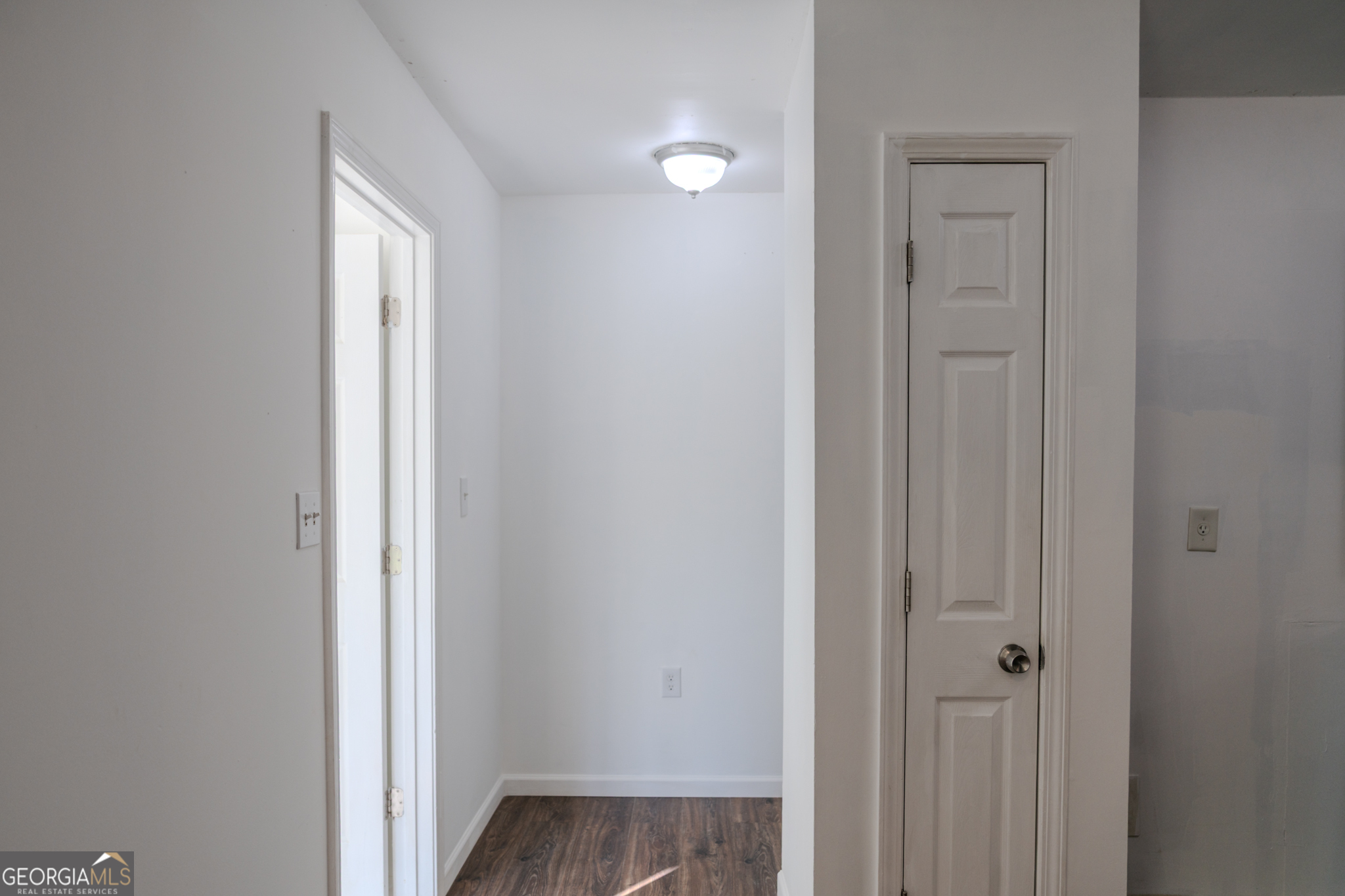 55 Corn Row Court Newnan, GA 30263 - Photo 45 of 72 a view of a hallway with wooden floor