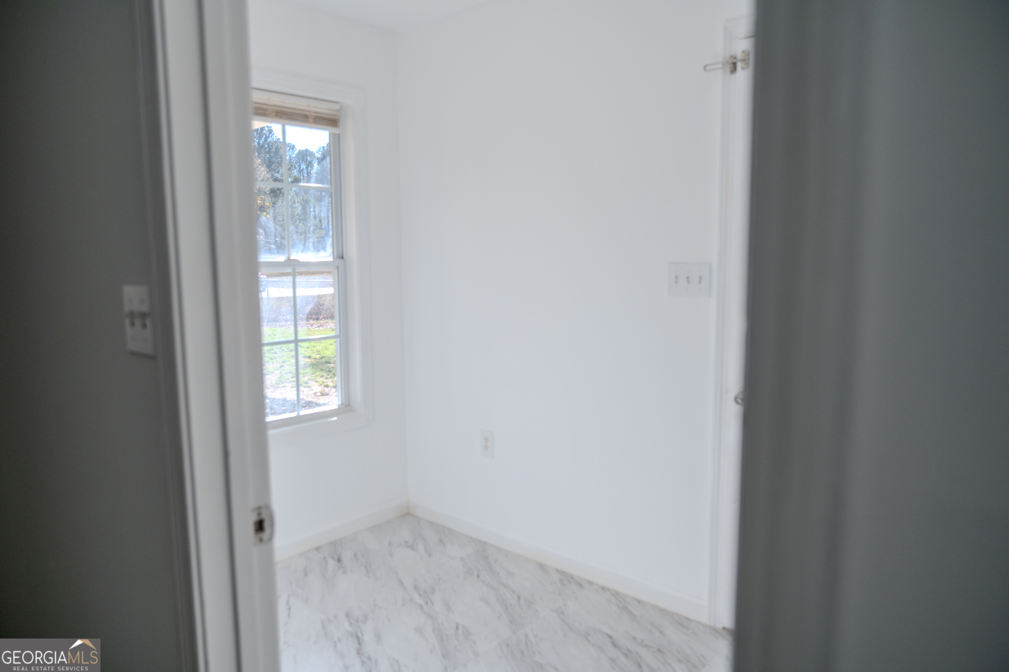 55 Corn Row Court Newnan, GA 30263 - Photo 46 of 72 a view of an empty room with windows and closet