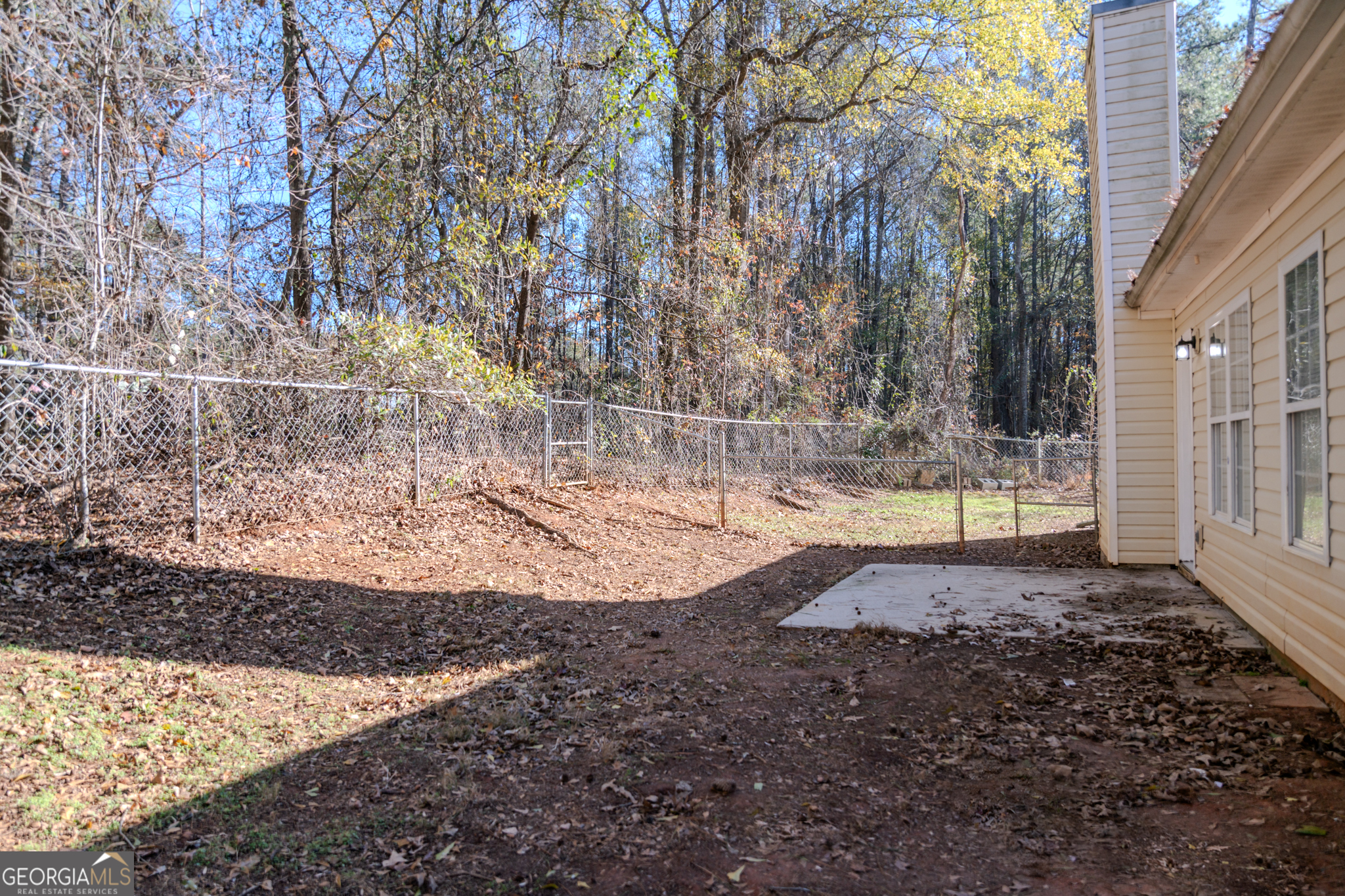 55 Corn Row Court Newnan, GA 30263 - Photo 60 of 72 a view of a backyard with large trees