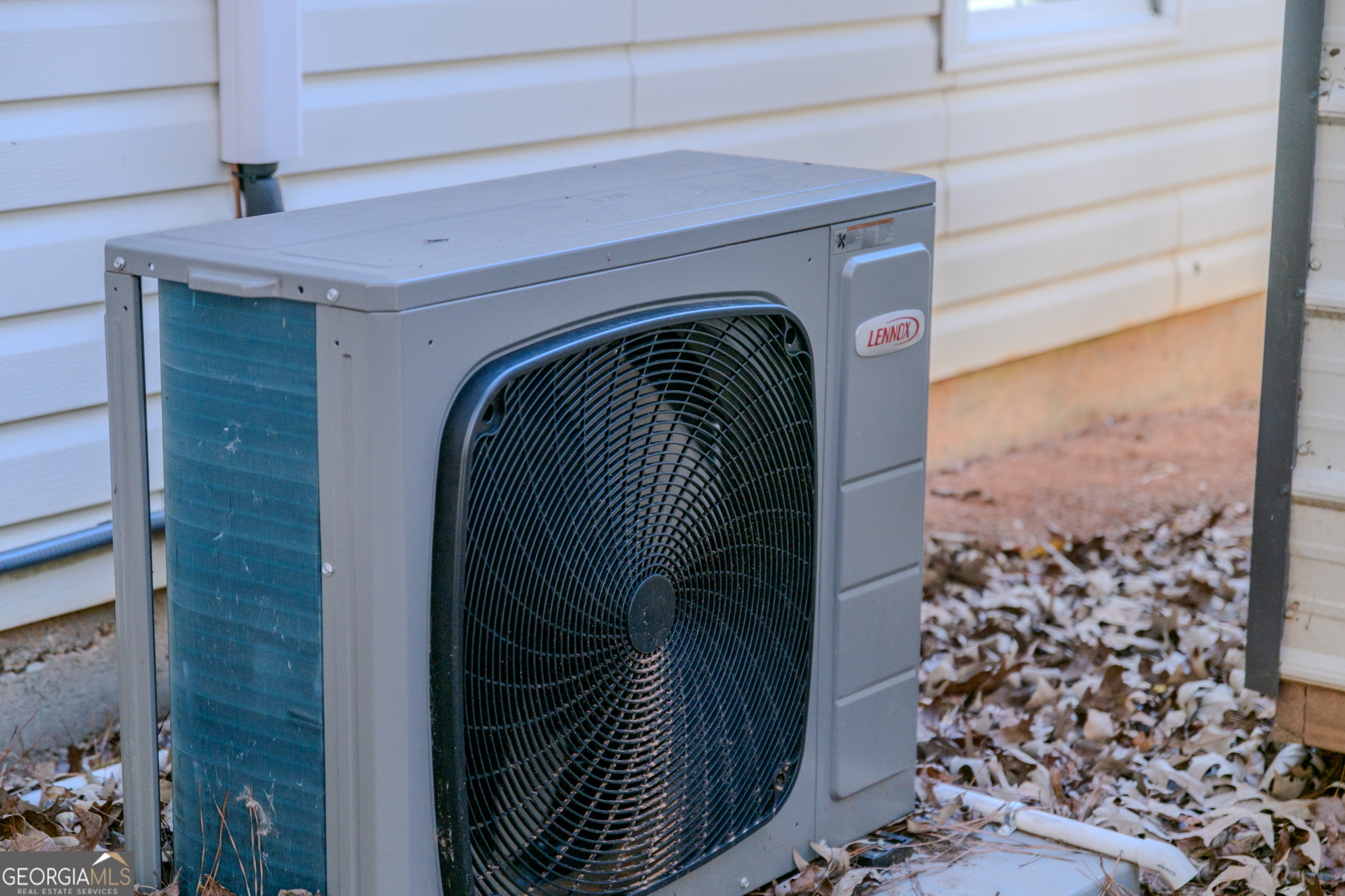 55 Corn Row Court Newnan, GA 30263 - Photo 63 of 72 a view of walk in closet with clothes and shoes