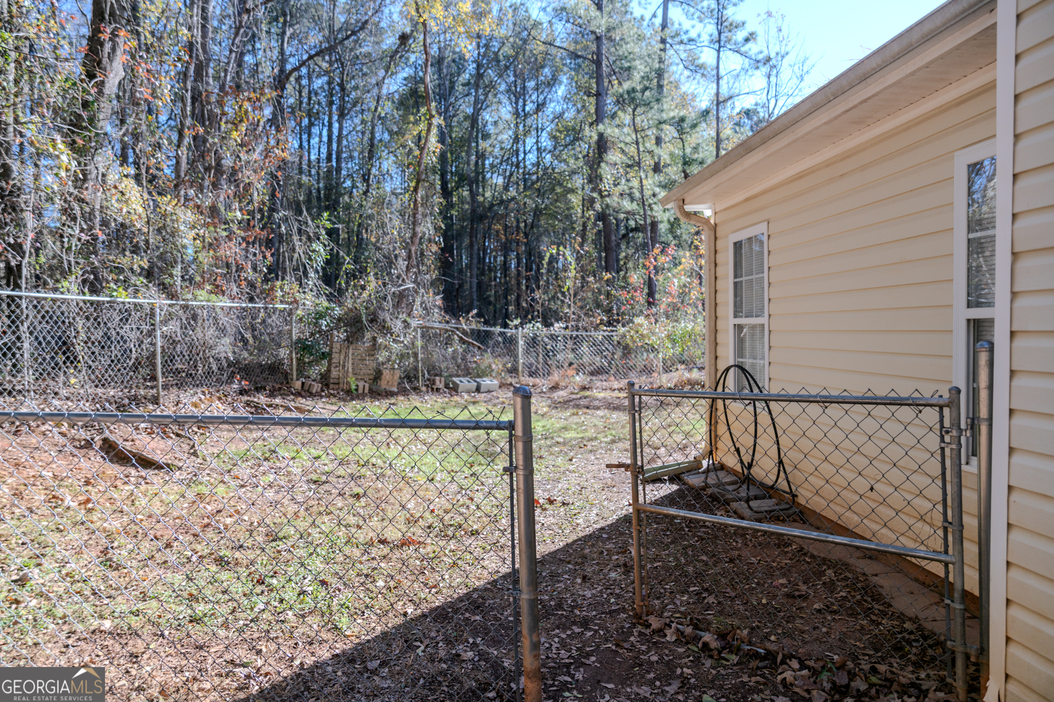 55 Corn Row Court Newnan, GA 30263 - Photo 69 of 72 a view of a backyard with trees