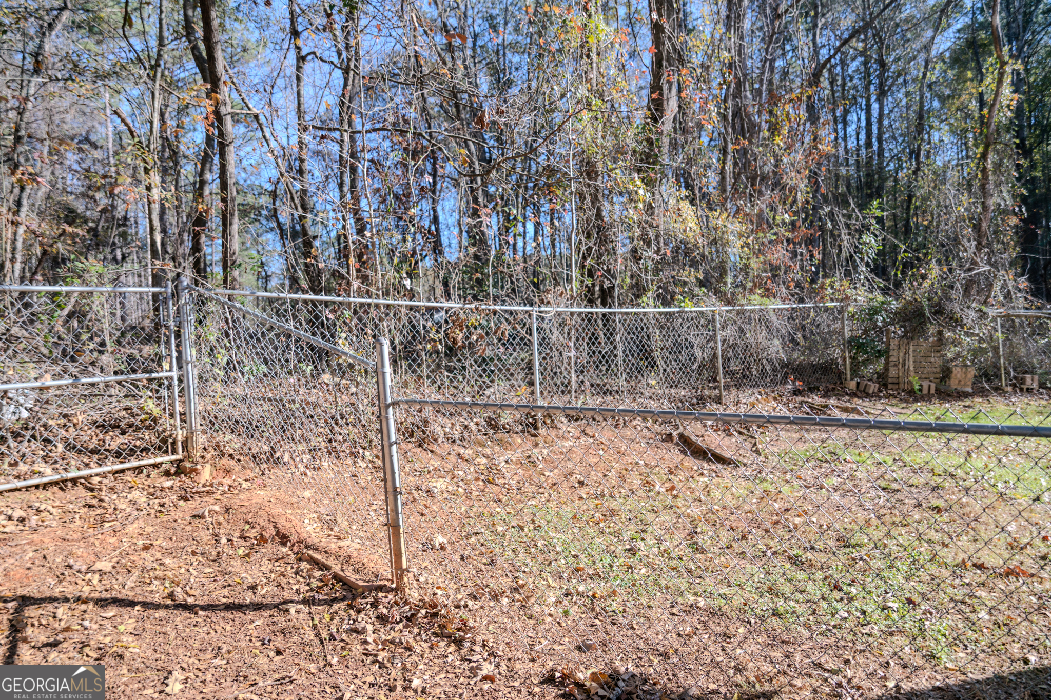 55 Corn Row Court Newnan, GA 30263 - Photo 70 of 72 a view of a yard with wooden fence