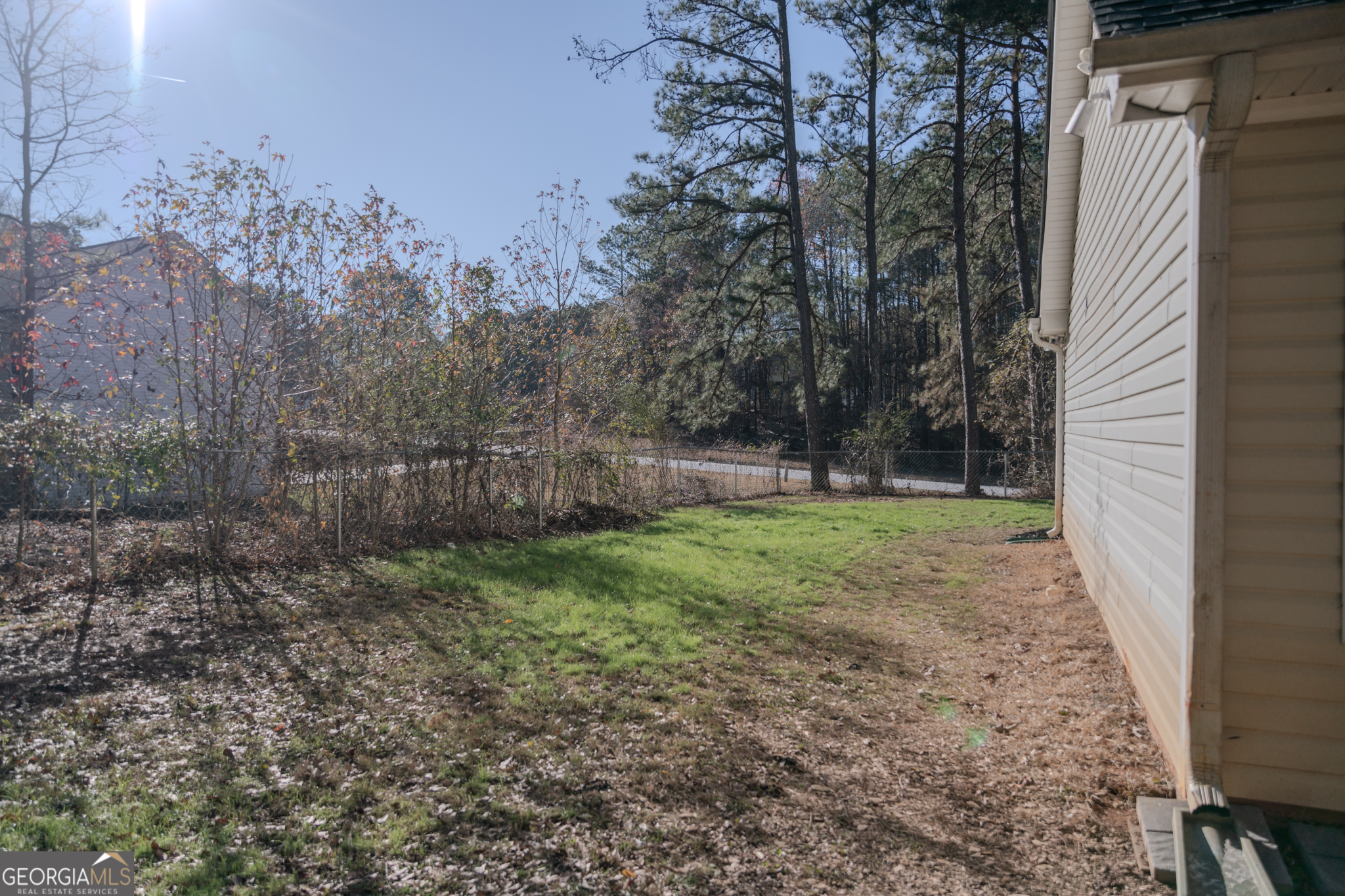 55 Corn Row Court Newnan, GA 30263 - Photo 71 of 72 a view of outdoor space with deck and yard