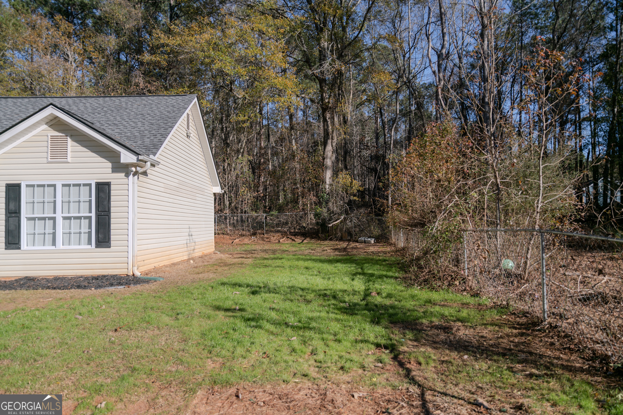 55 Corn Row Court Newnan, GA 30263 - Photo 72 of 72 a backyard of a house with lots of green space