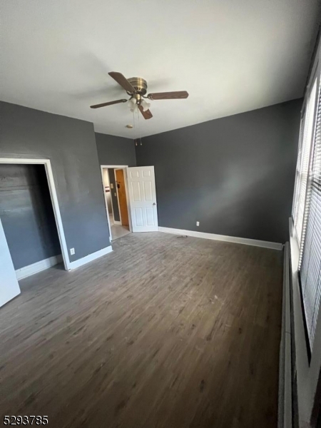 32 Rosehill Place, Unit 1 Irvington, NJ 07111 - Photo 2 of 9 a view of empty room with wooden floor