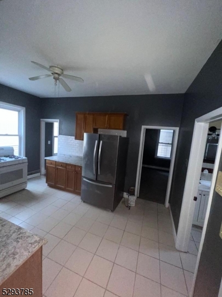 32 Rosehill Place, Unit 1 Irvington, NJ 07111 - Photo 5 of 9 a living room with furniture and a flat screen tv