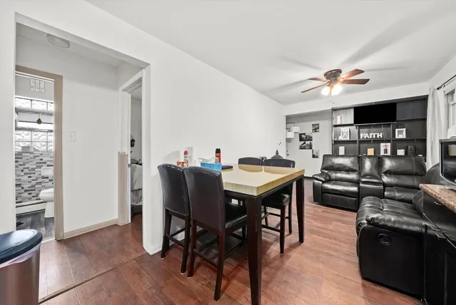 a kitchen with granite countertop a sink cabinets and stainless steel appliances