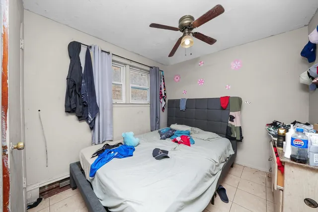 a living room with a couch and a chandelier