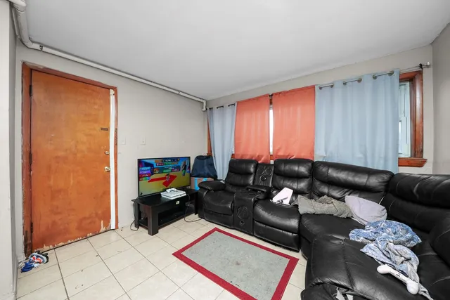 a room with furniture a chandelier and a window