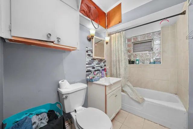 a kitchen with stainless steel appliances granite countertop a stove top oven a sink dishwasher and cabinets with wooden floor