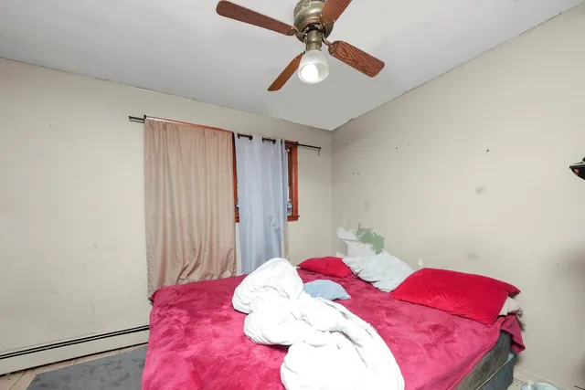 a view of a patio with a table and chairs and potted plants
