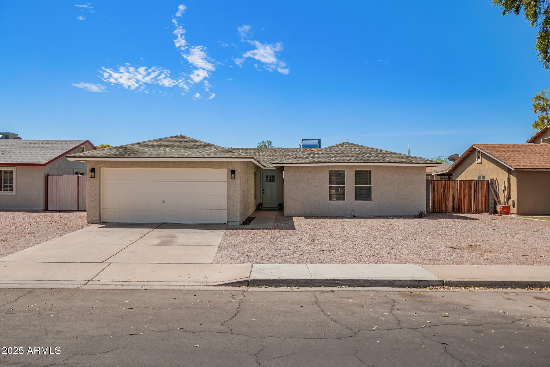 a view of a house with a yard and garage