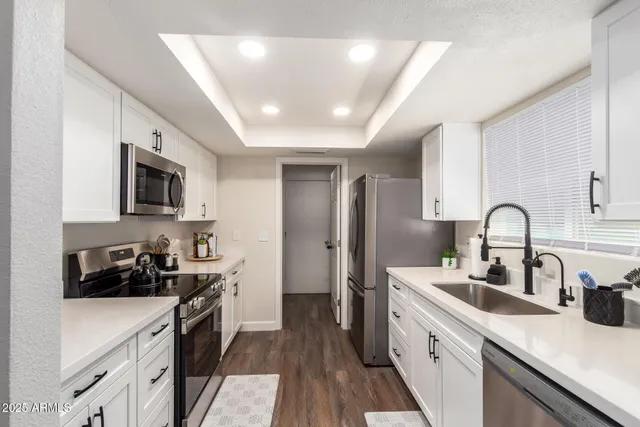 a dining room with furniture a window and wooden floor