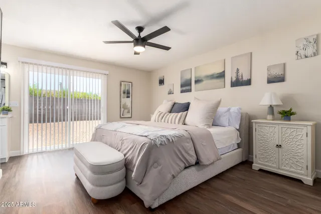 a kitchen with a sink cabinets and wooden floor