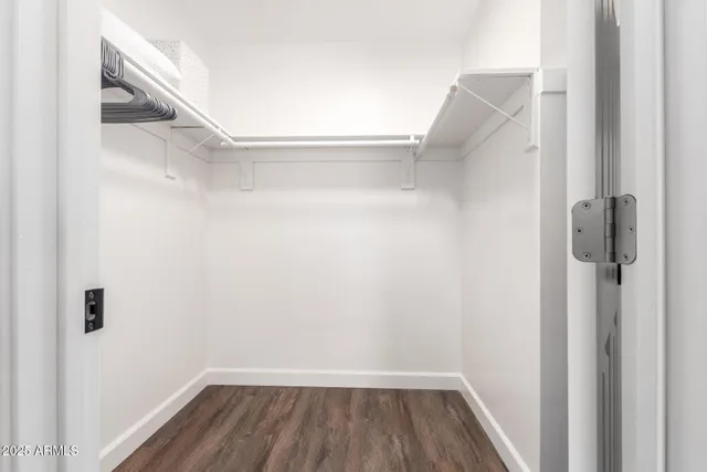 a white toilet next to a bathroom sink