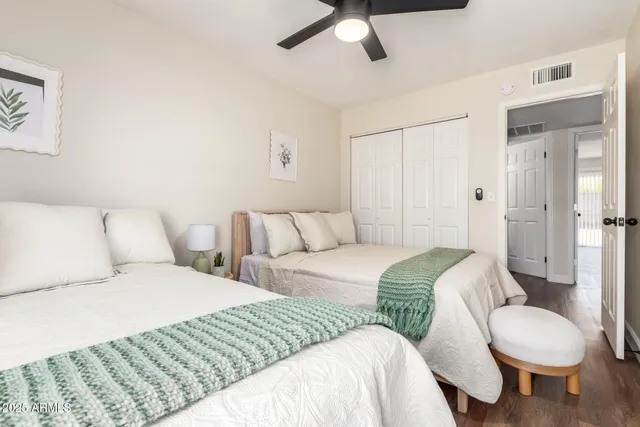 a bedroom with a bed and couch