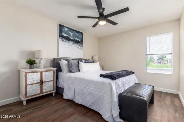 a bedroom with a bed and couch