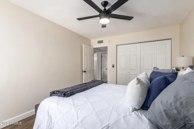 a bedroom with a bed and a window