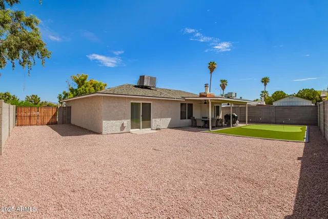 a view of a house with swimming pool and porch