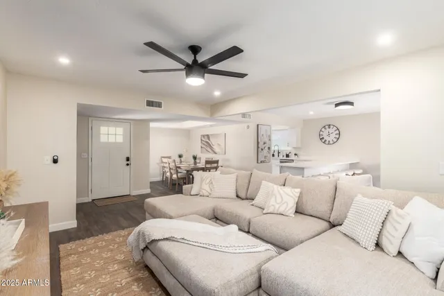 a living room with a flat screen tv and a couch
