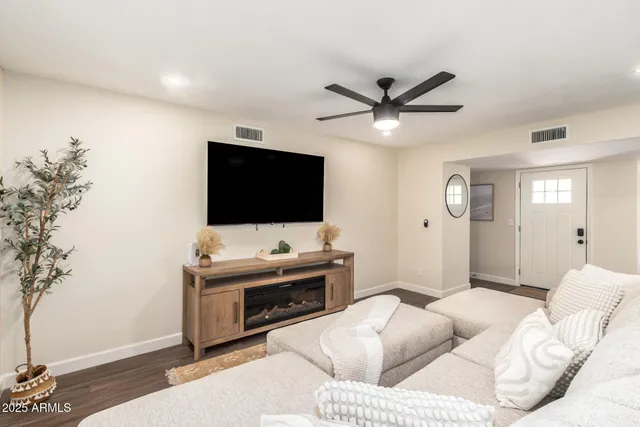 a living room with furniture and a large window
