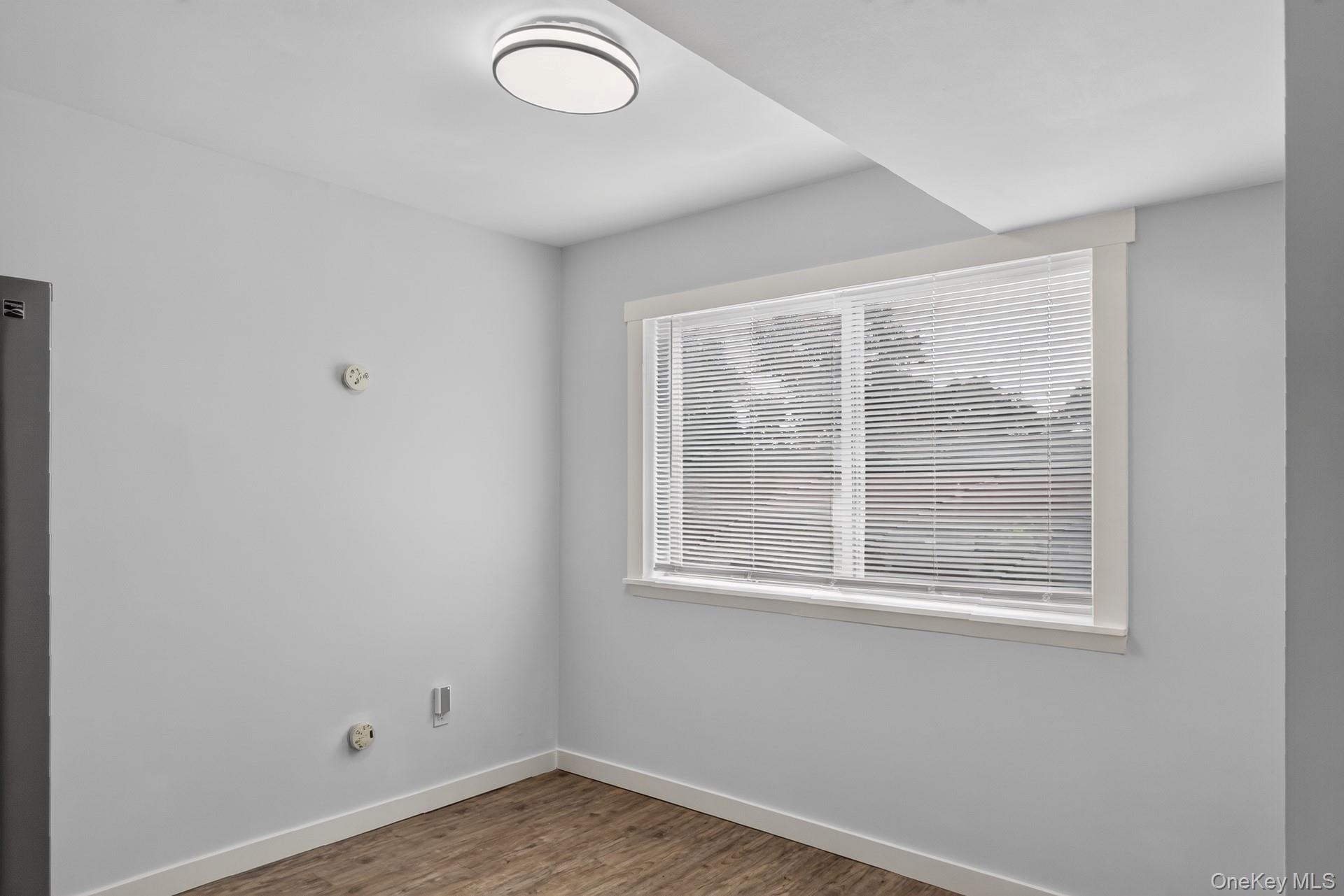 26 Cooper Road, Unit 414 Poughkeepsie, NY 12603 - Photo 18 of 24 Light gray interior walls with white baseboards and window trim