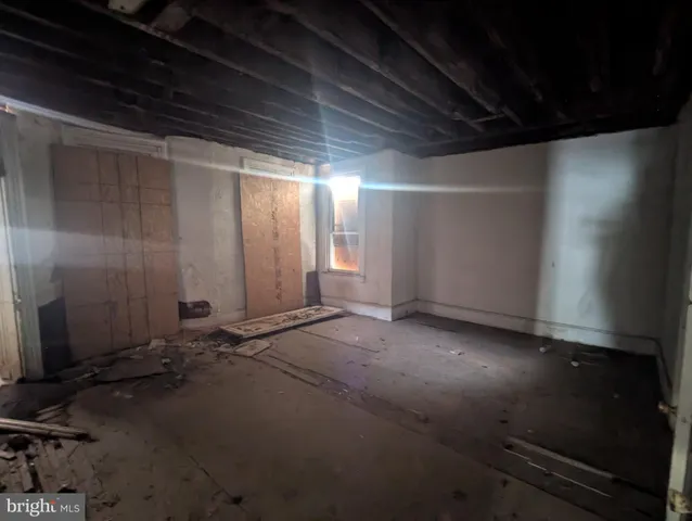a view of a hallway with wooden door
