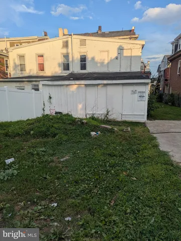 a view of a house with a back yard