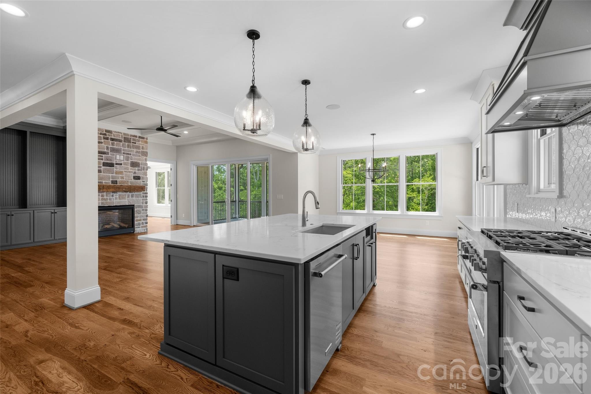 537 Riddle Mill Road Clover, SC 29710 - Photo 17 of 46 a kitchen with granite countertop a stove and a sink
