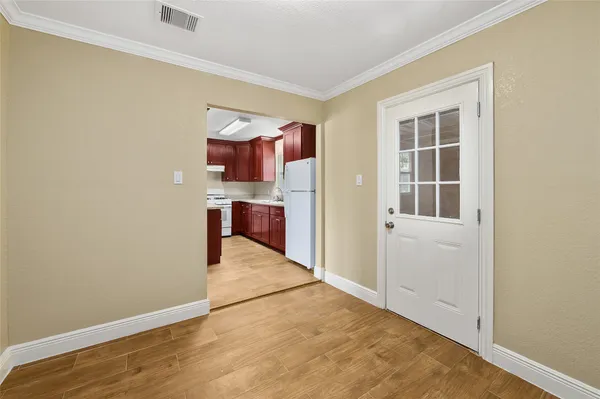 a view of kitchen and wooden floor