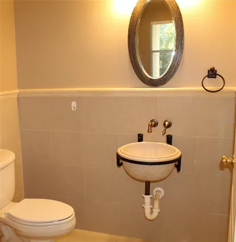 a kitchen with granite countertop stainless steel appliances and wooden cabinets