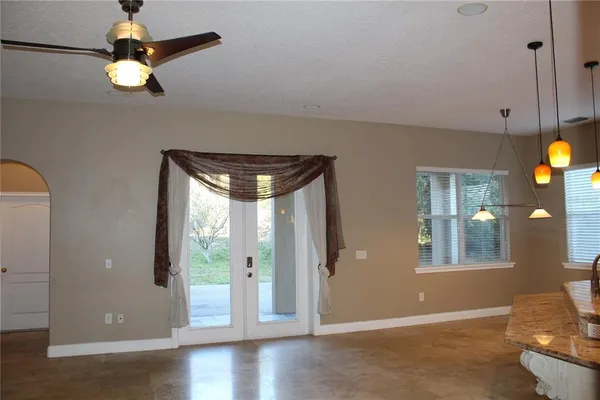 a kitchen with a refrigerator and window